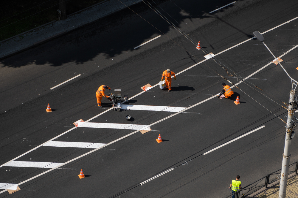 road painters using thermoplastic road paint