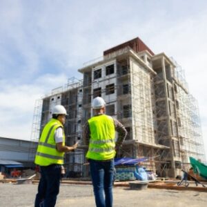 two construction workers standing