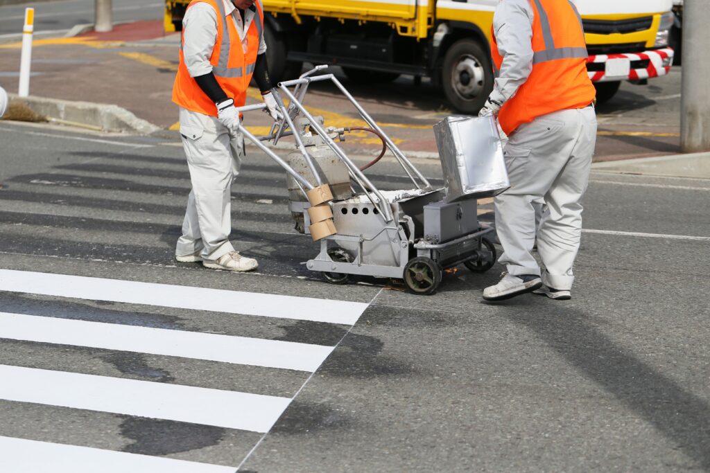 contractors painting a pedestrian lane