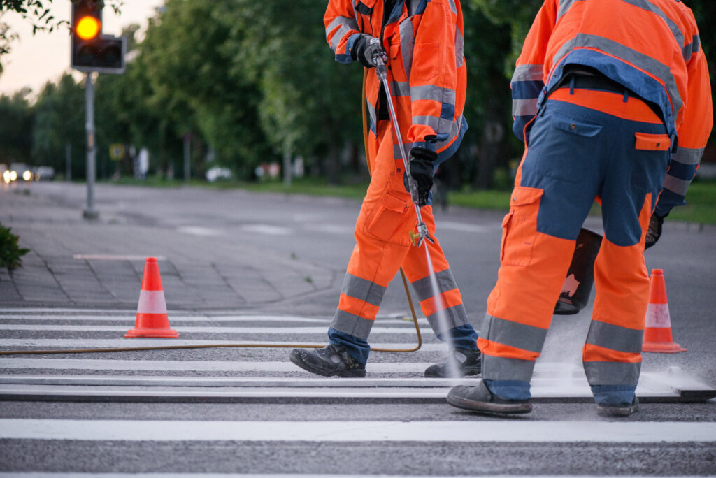 contractors painting a highway