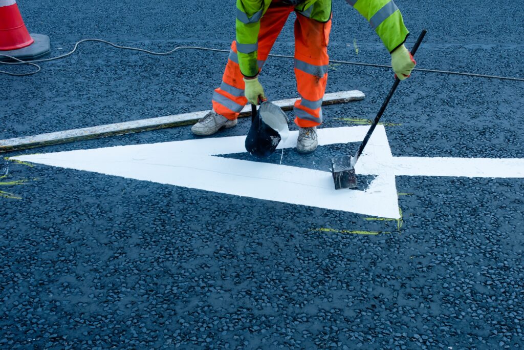 a road safety officer putting road markings
