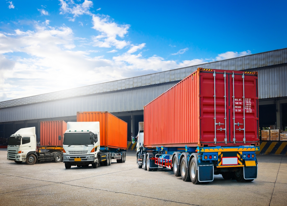 trucks parked on a warehouse