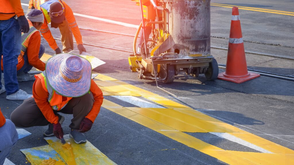 road workers putting in road markings